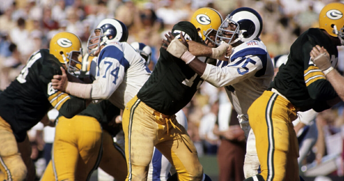 Two Hall of Famers, Los Angeles Rams defensive end Deacon Jones and Green Bay Packers tackle Forrest Gregg, battle it out during a 34-21 Rams victory on Oct. 19, 1969, at the Los Angeles Memorial Coliseum in Los Angeles.