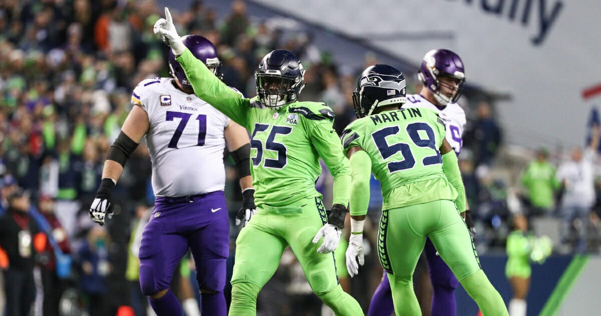 Frank Clark of the Seattle Seahawks celebrates a second quarter defensive stop against the Minnesota Vikings at CenturyLink Field on Dec. 10, 2018 in Seattle.