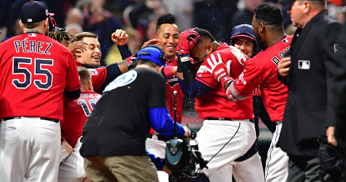 Carlos Santana of the Cleveland Indians celebrates as he rounds the bases after hitting a walk-off solo home run during the ninth inning against the Toronto Blue Jays at Progressive Field on April 5, 2019 in Cleveland.