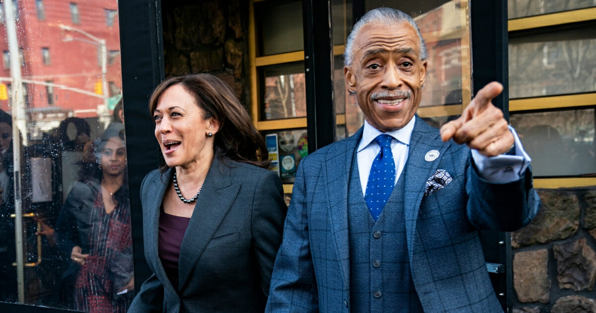 2020 Democratic presidential candidate Sen. Kamala Harris and Rev. Al Sharpton exit after having lunch at Sylvia's Restaurant in Harlem.
