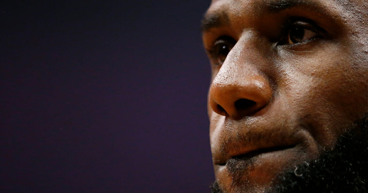 LeBron James of the Los Angeles Lakers looks on during a timeout in the first half of the game against the Los Angeles Clippers at Staples Center on April 5, 2019 in Los Angeles.