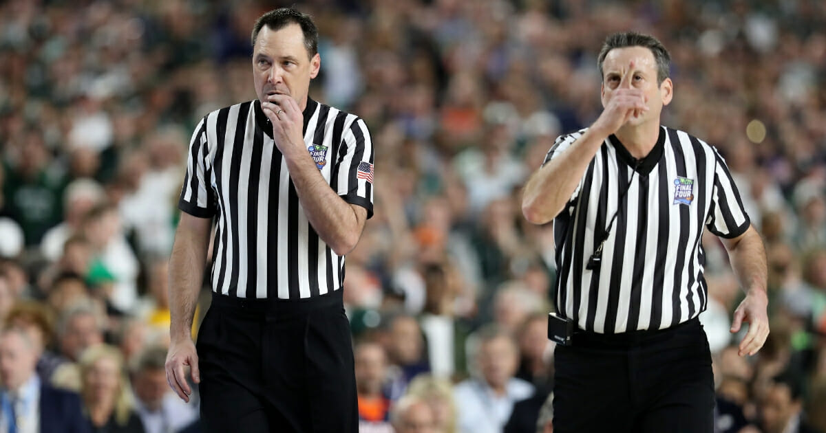Referees react in the second half during the 2019 NCAA Final Four semifinal between the Auburn Tigers and the Virginia Cavaliers at U.S. Bank Stadium on April 6, 2019.