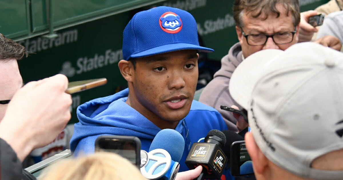 Addison Russell of the Chicago Cubs talks to the media.