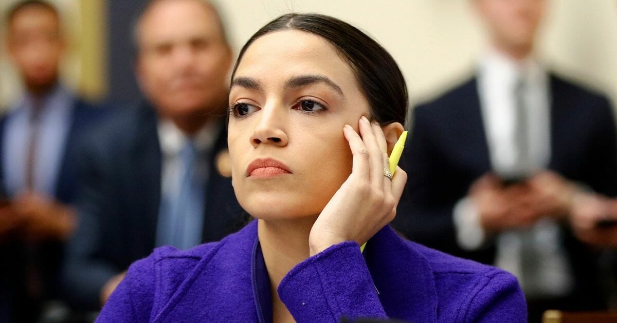 Rep. Alexandria Ocasio-Cortez listens during a House Financial Services Committee hearing April 10, 2019, in Washington, D.C.