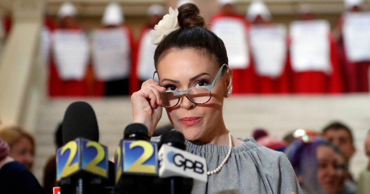 Actress Alyssa Milano speaks after delivering a letter to Gov. Brian Kemp's office on April 2, 2019, in Atlanta.