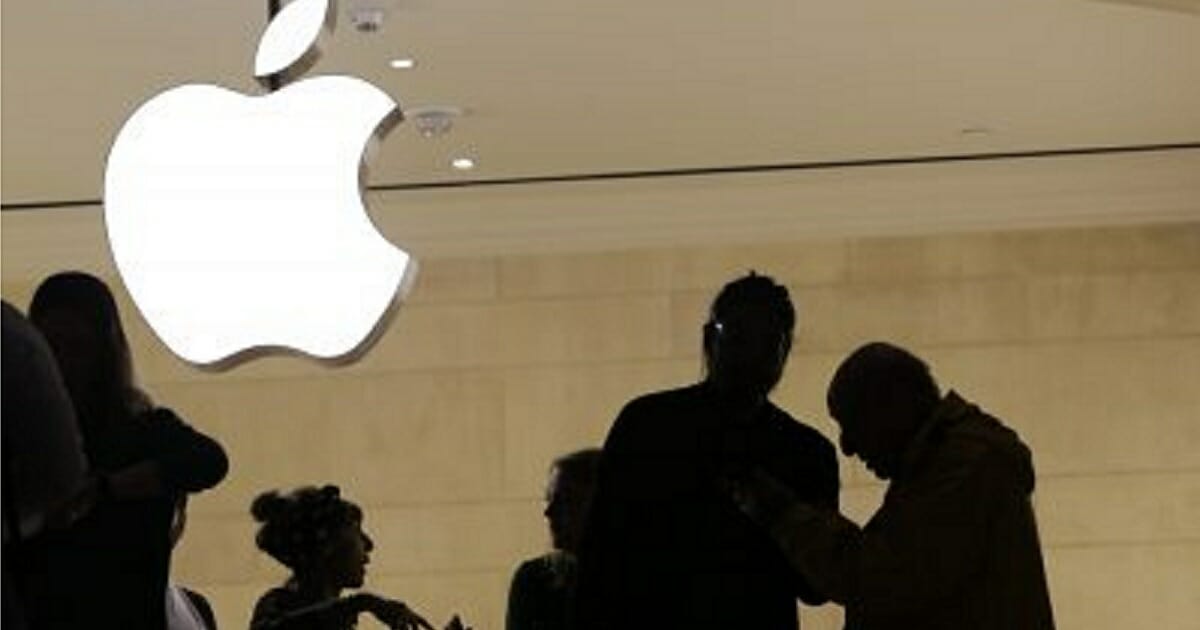 Customers enter the Apple store in New York City last year.