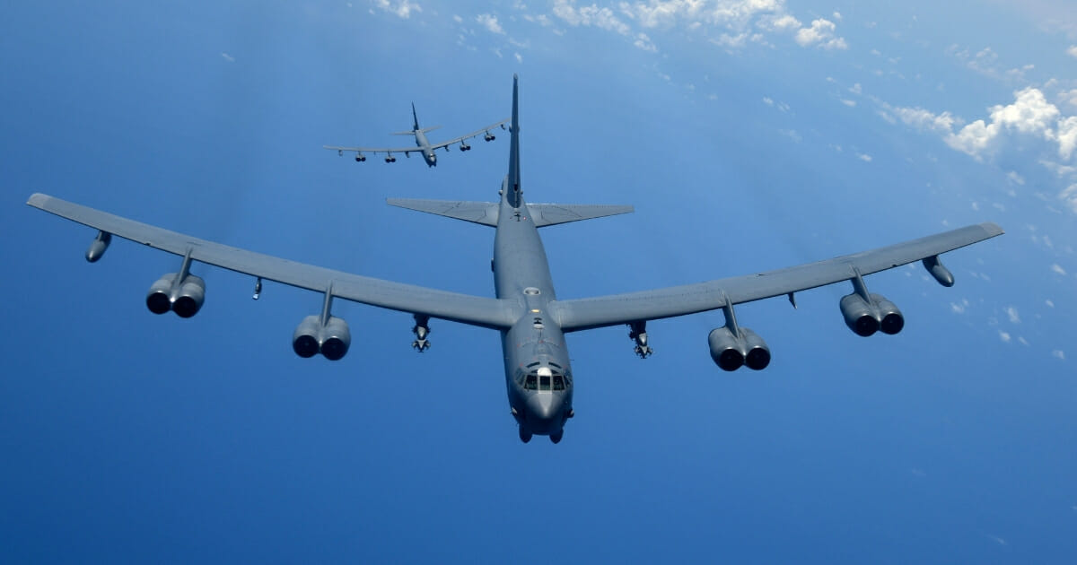 Two B-52H Stratofortress bombers fly over the Pacific Ocean during a training mission Aug. 2, 2018.