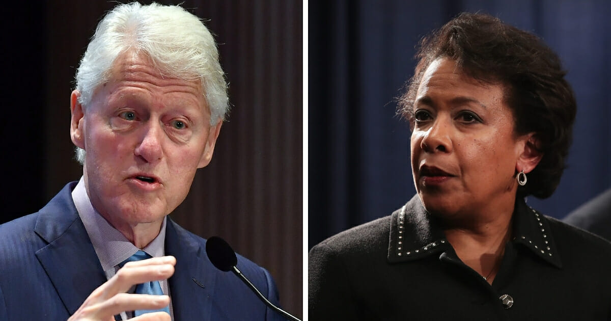 Former President Bill Clinton, left, met with then-U.S. Attorney General Loretta Lynch, right, on her plane at Sky Harbor airport in Phoenix on June 27, 2016.