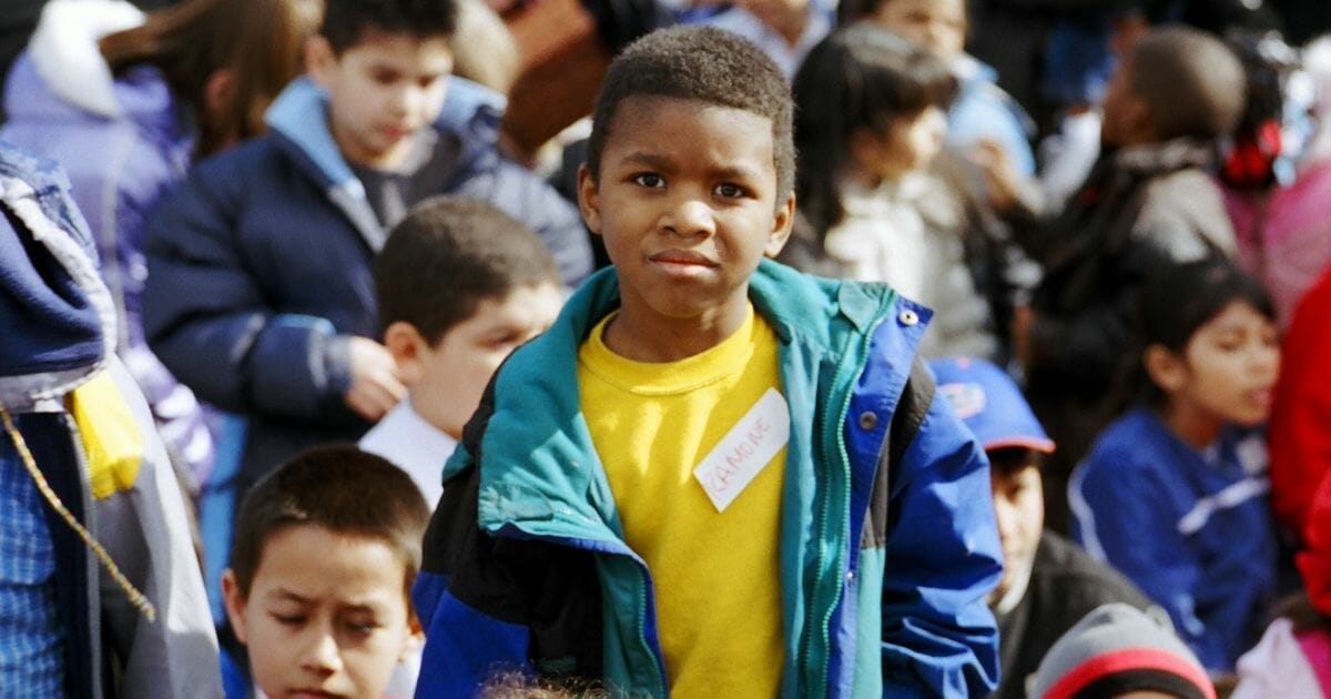 A boy in a crowd.