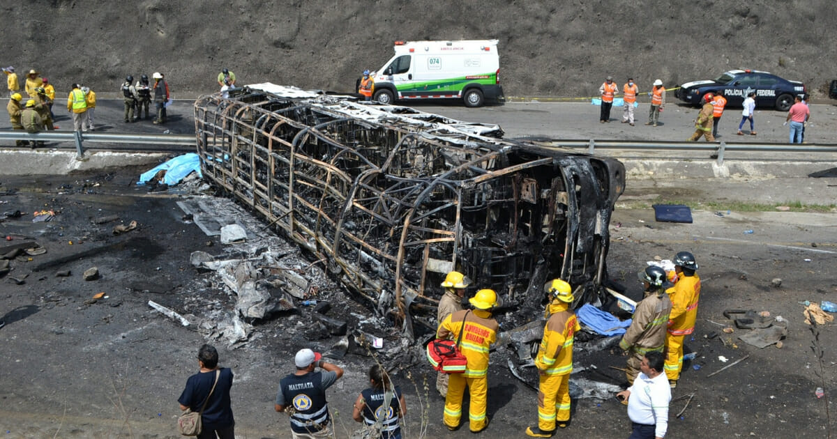 Rescuers and firefighters work the scene after a bus carrying Catholic pilgrims collided with a semi-trailer on a mountain road in Veracruz, Mexico.