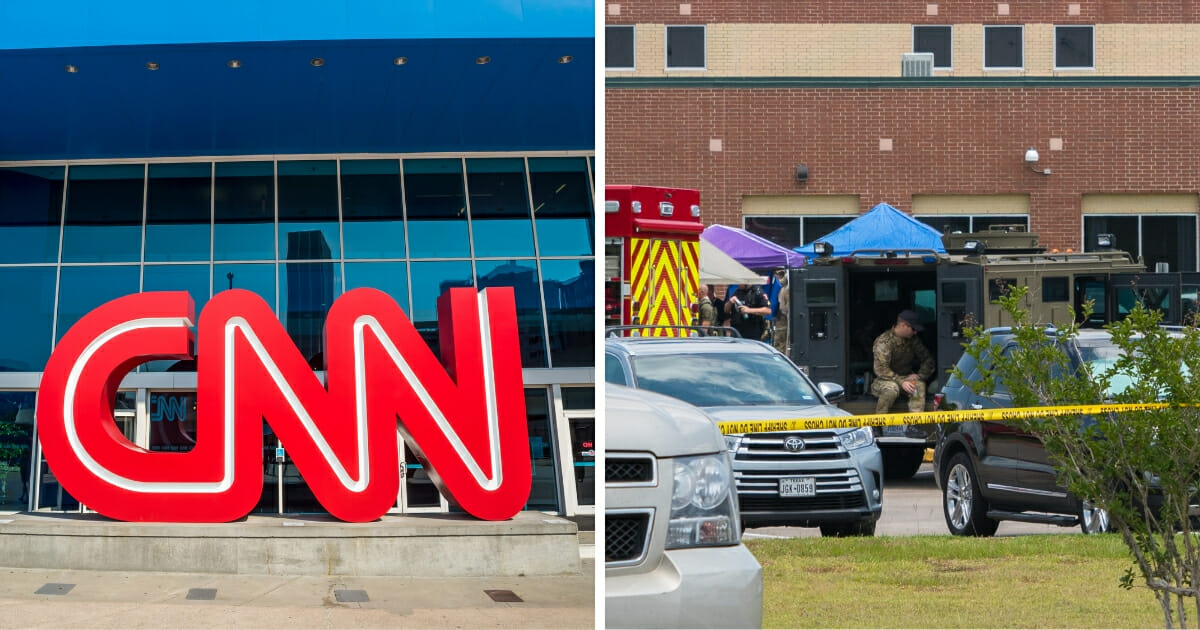 CNN logo opposite a school parking lot after a school shooting