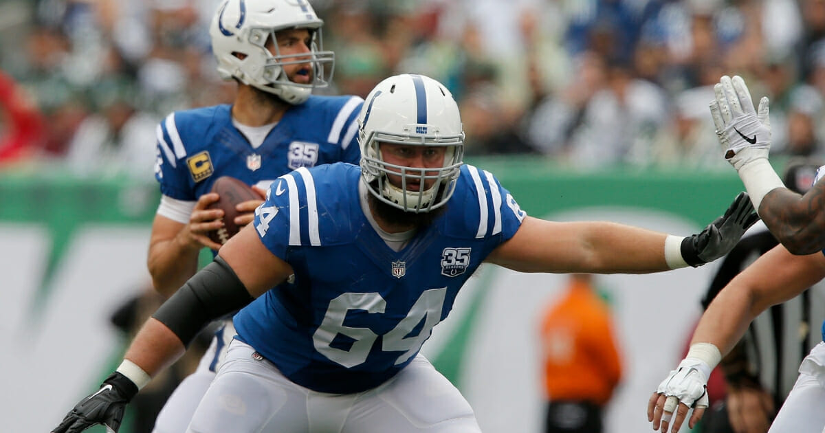 Mark Glowinski of the Indianapolis Colts protects quarterback Andrew Luck