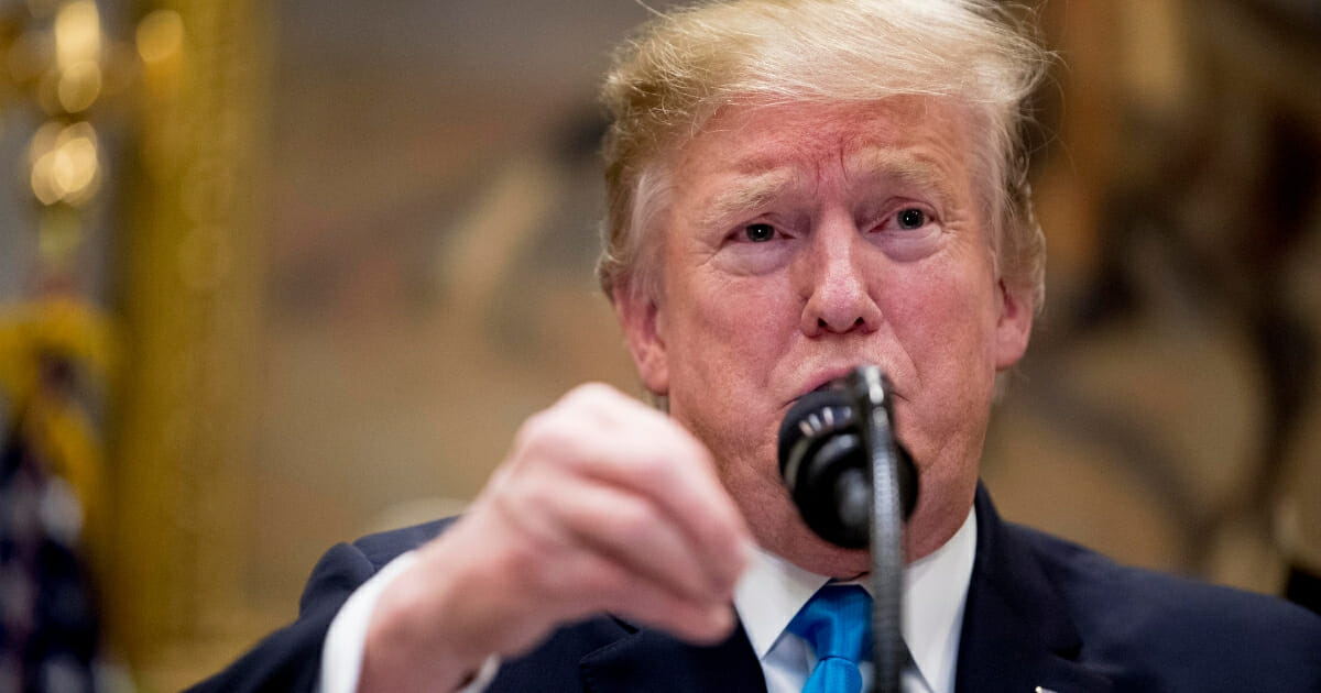 President Donald Trump gestures as he answers a question from a reporter during a meeting to support America's farmers and ranchers in the Roosevelt Room of the White House on May 23, 2019, in Washington. (Andrew Harnik / AP Photo)