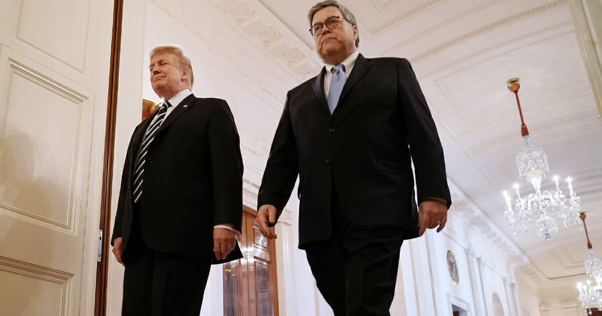 President Donald Trump, left, and Attorney General William Barr arrive together for the presentation of the Public Safety Officer Medals of Valor in the East Room of the White House on May 22, 2019 in Washington, D.C. Comparable to the military's Medal of Honor, the Medal of Valor was established in 2000 by President Bill Clinton.