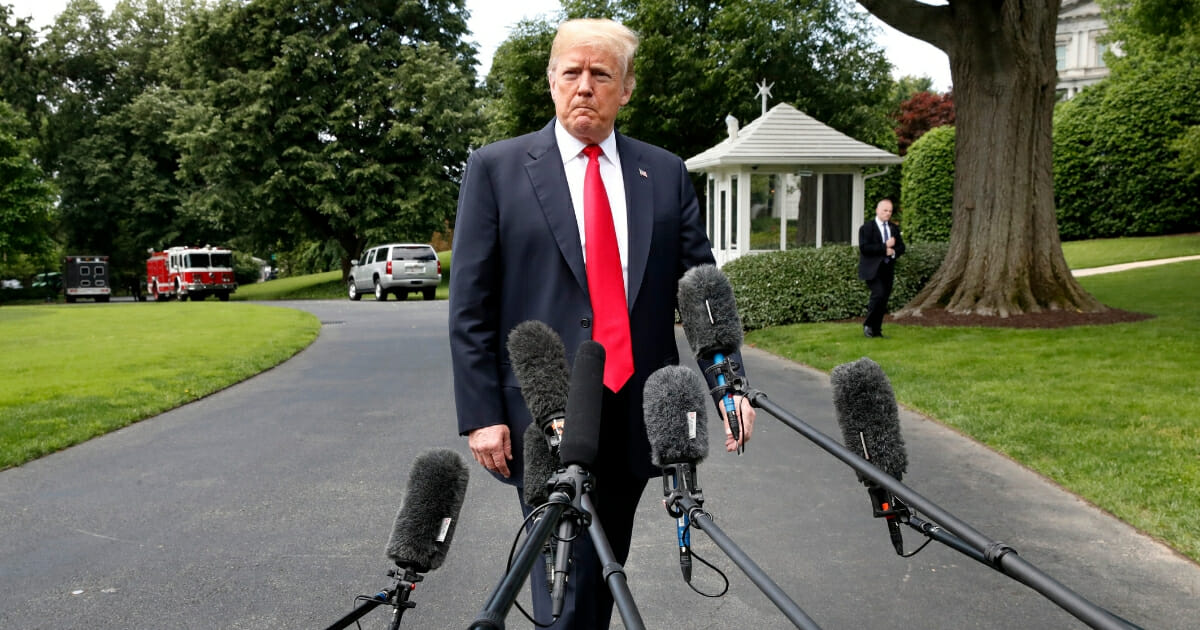Donald Trump in front of microphones