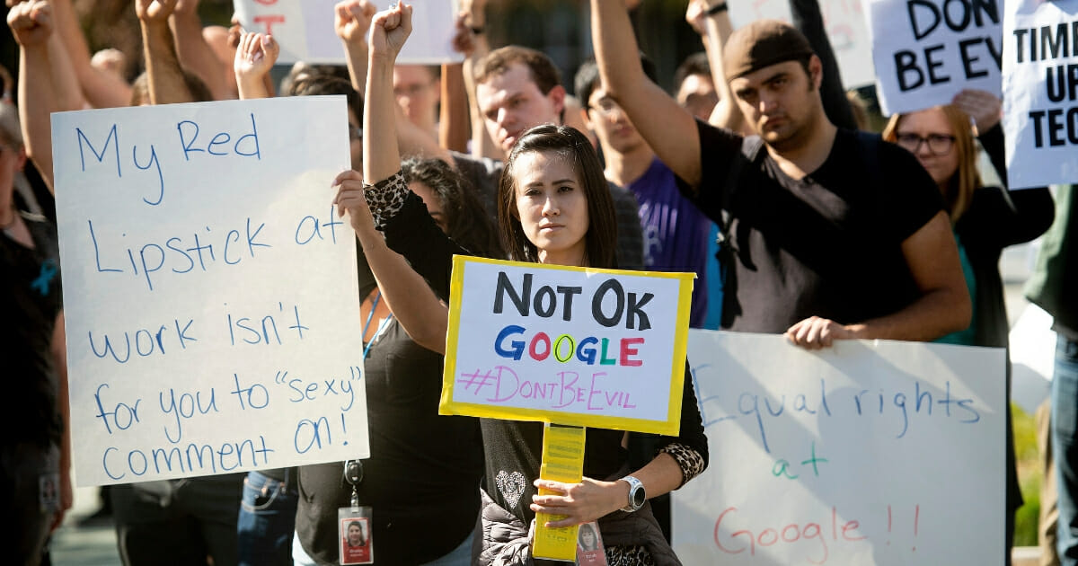 Workers protest against Google's handling of sexual misconduct allegations at the company's Mountain View, California, headquarters on Thursday, Nov. 1, 2018.