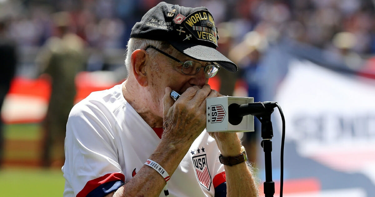 World War II veteran "Harmonica Pete" DuPre performs the national anthem before a soccer match between the U.S. Women’s National Team and Mexico.