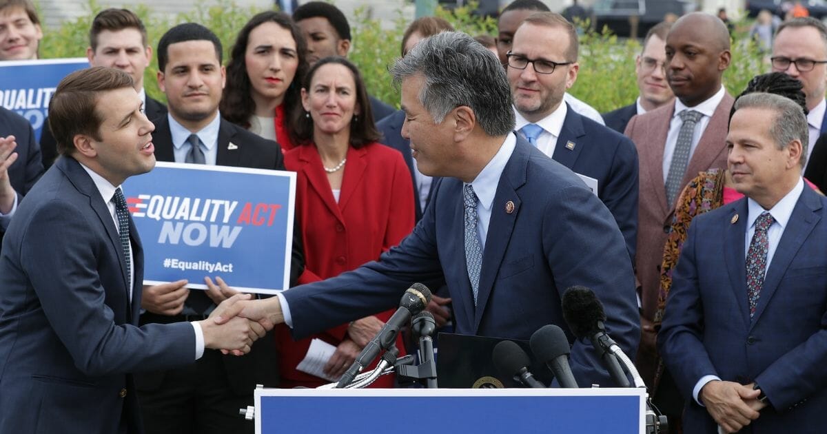 Rep. Mark Takano welcomes Rep. Chris Pappas, left, during a rally and news conference with Rep. David Cicilline and leaders from LGBTQ advocacy organizations before the House votes on the Equality Act on Friday, May 17, 2019,. in Washington, D.C.