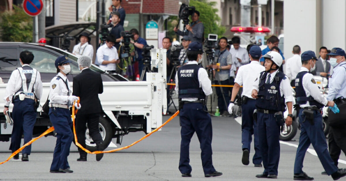 Police officers work at the scene where a man wielding a knife attacked commuters in Kawasaki, near Tokyo on May 28, 2019. (Koji Sasahara / AP Photo)