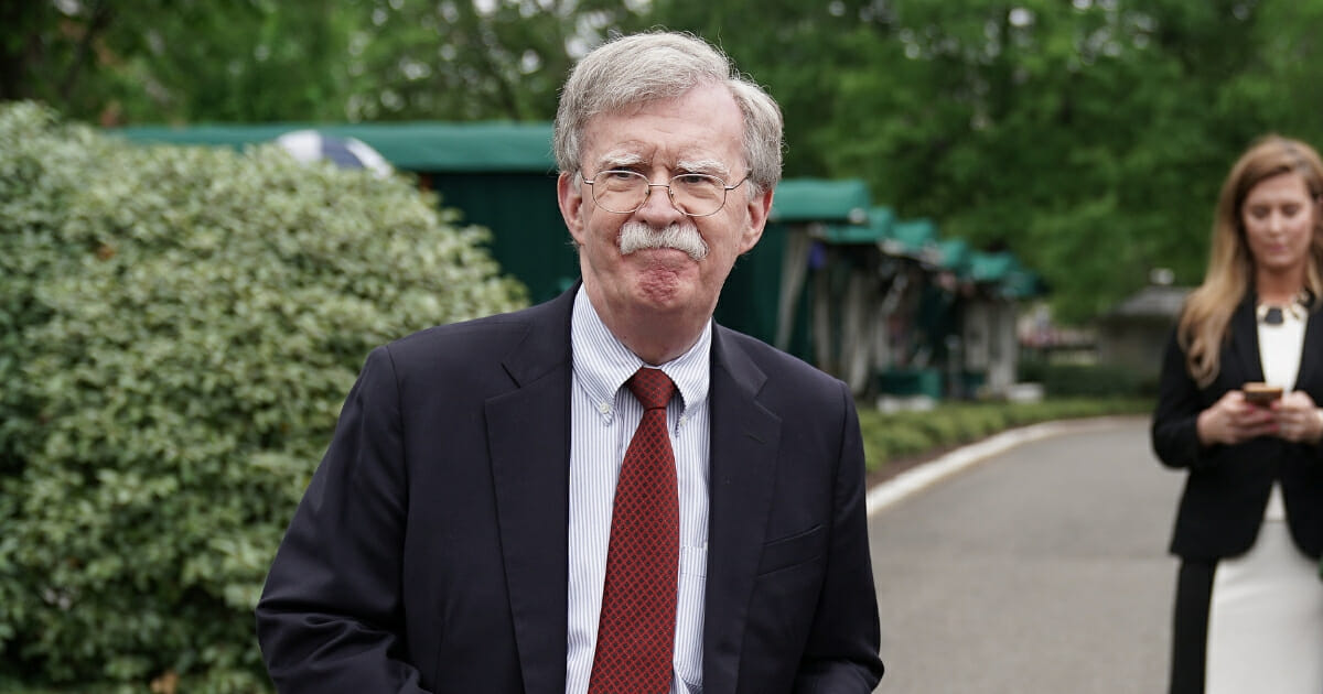 White House National Security Adviser John Bolton talks to reporters following a television interview outside the West Wing May 1, 2019, in Washington, D.C.