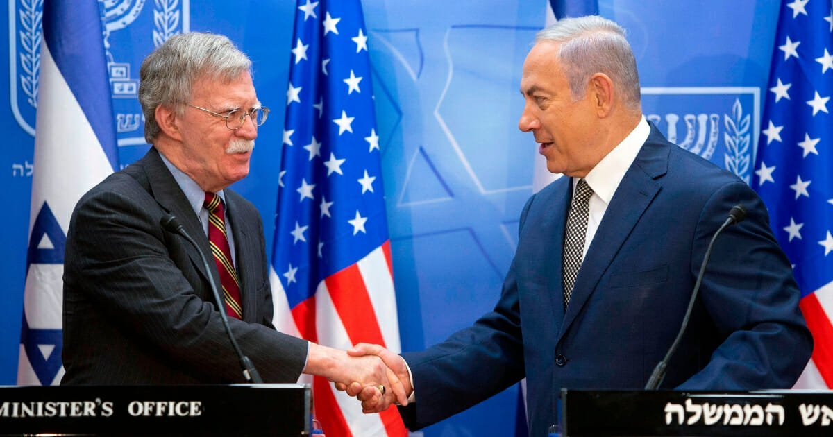 Israeli Prime Minister Benjamin Netanyahu (right) shakes hands with visiting U.S. national security adviser John Bolton (left) during a press conference at the Prime Minister's office in Jerusalem on Aug. 20, 2018.