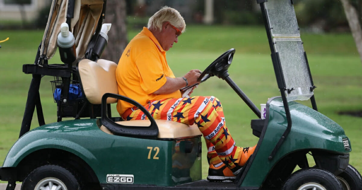 John Daly checks his scorecard during the Insperity Invitational at The Woodlands Country Club on May 3, 2019, in The Woodlands, Texas.