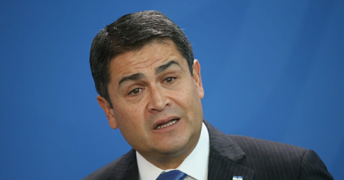 Honduran President Juan Orlando Hernandez speaks to the media with German Chancellor Angela Merkel (not pictured) following talks on October 27, 2015 in Berlin, Germany.