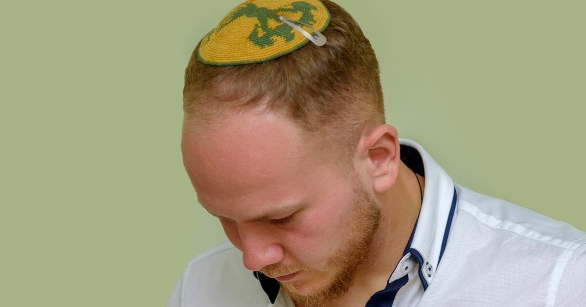 A Jewish man wearing a kippah.