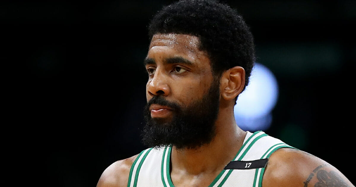 Kyrie Irving of the Boston Celtics looks on during Game 4 of his team's playoff series against the Milwaukee Bucks.