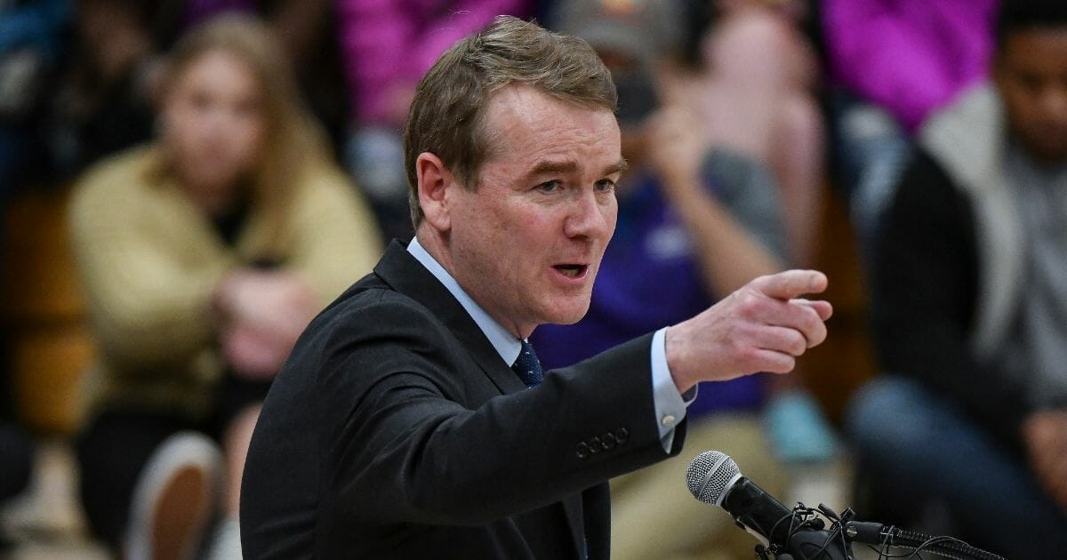 Colorado Sen. Michael Bennet speaks during a candlelight vigil at Highlands Ranch High School on May 8, 2019, in Highlands Ranch, Colo.