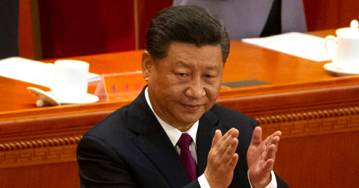 Chinese President Xi Jinping applauds during a commemoration April 30, 2019, in Beijing.