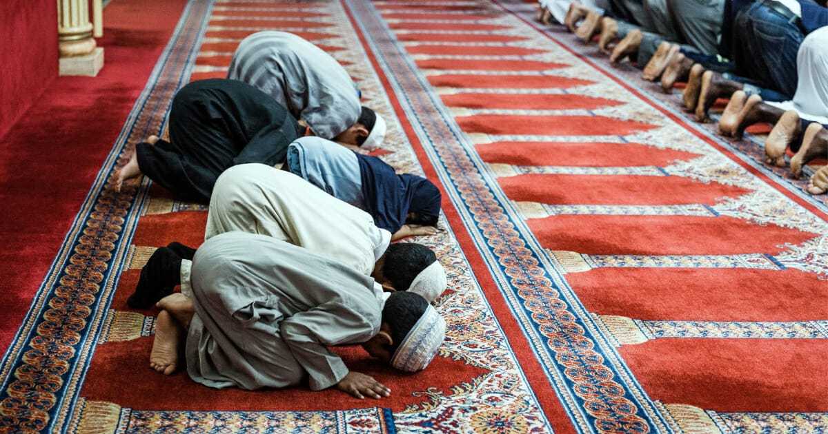 Muslim worshippers perform the evening prayer at the end of the first day of Ramadan.
