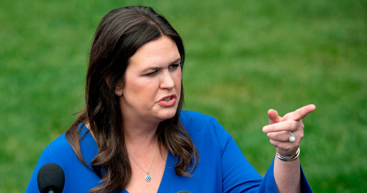 White House press secretary Sarah Sanders talks with the media corps outside the West Wing of the White House in Washington, D.C., on May 3, 2019. (JIM WATSON / AFP / Getty Images)