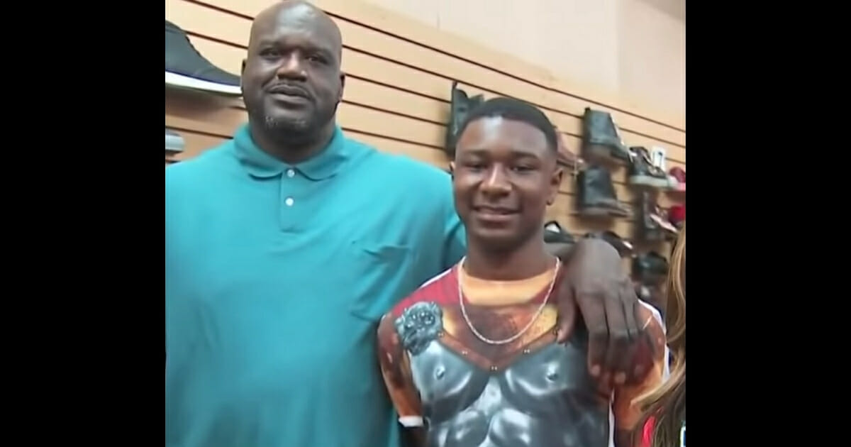 Shaq and Zach standing together.