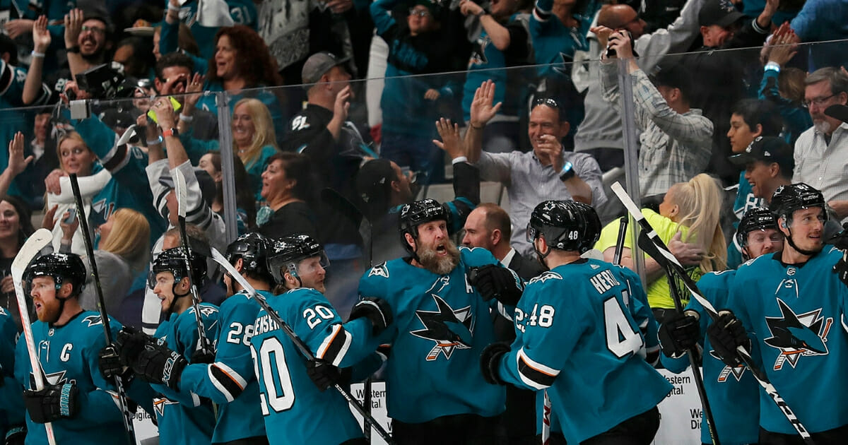 San Jose Sharks players and fans celebrate after Joonas Donskoi scored a goal against the Colorado Avalanche on Wednesday, May 8, 2019, in San Jose.