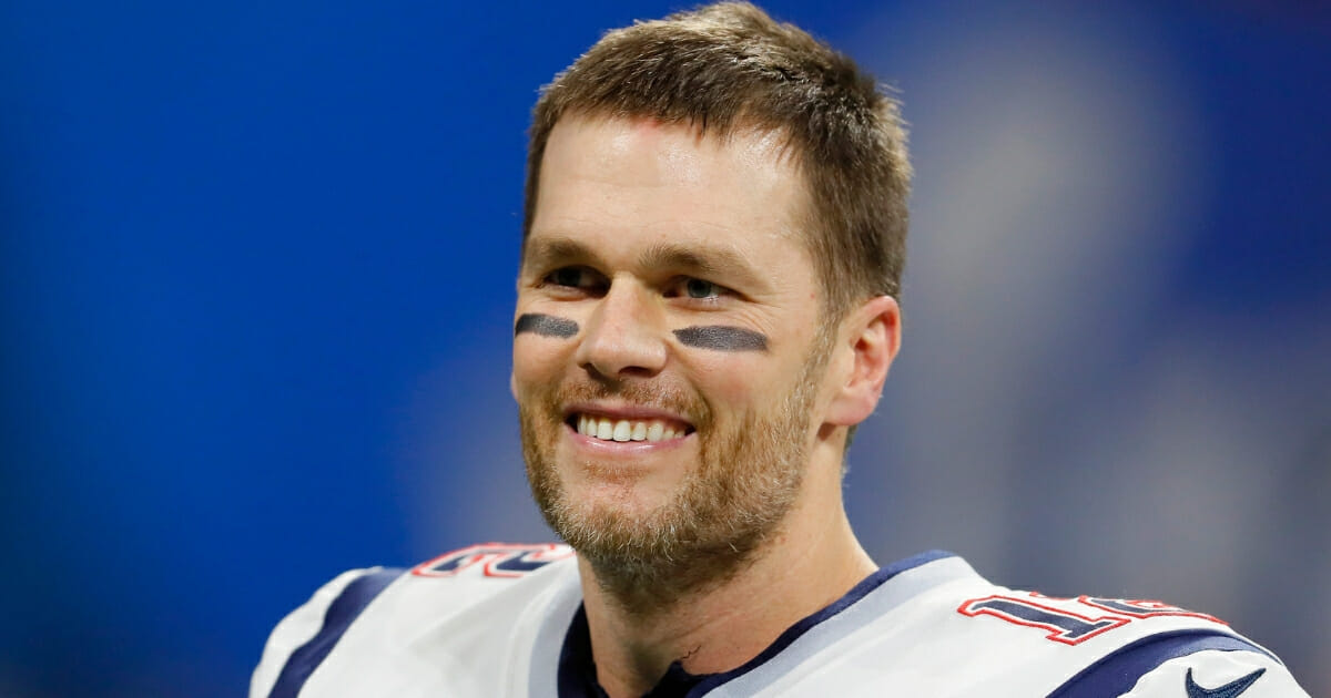 New England Patriots quarterback Tom Brady smiles.