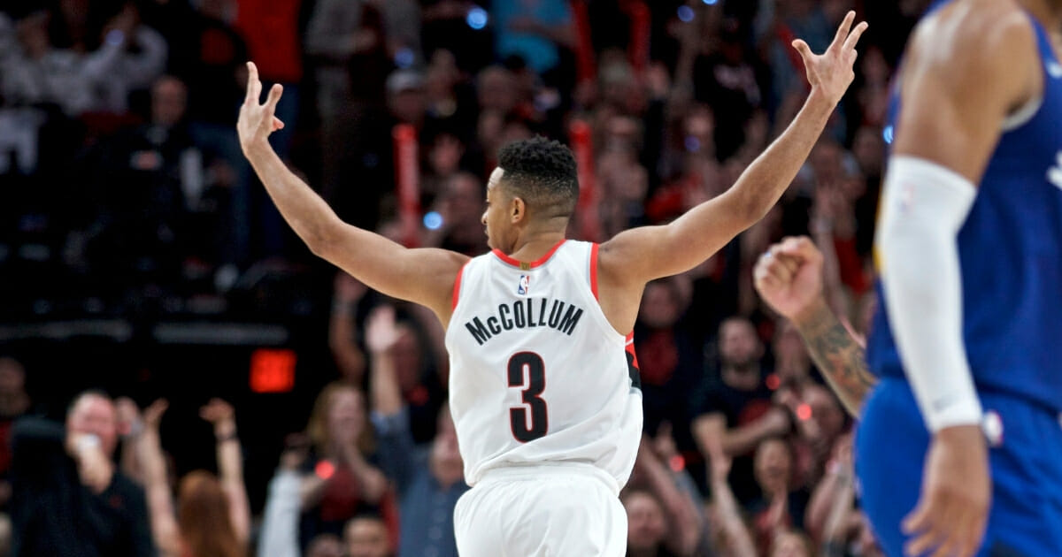 Portland Trail Blazers guard CJ McCollum reacts after making a three-point basket against the Denver Nuggets during Game 3 on Friday, May 3, 2019, in Portland.