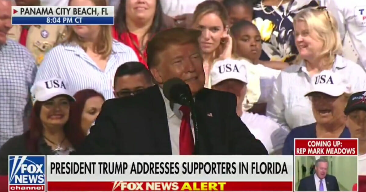 Trump speaking at a rally, responding to a heckler