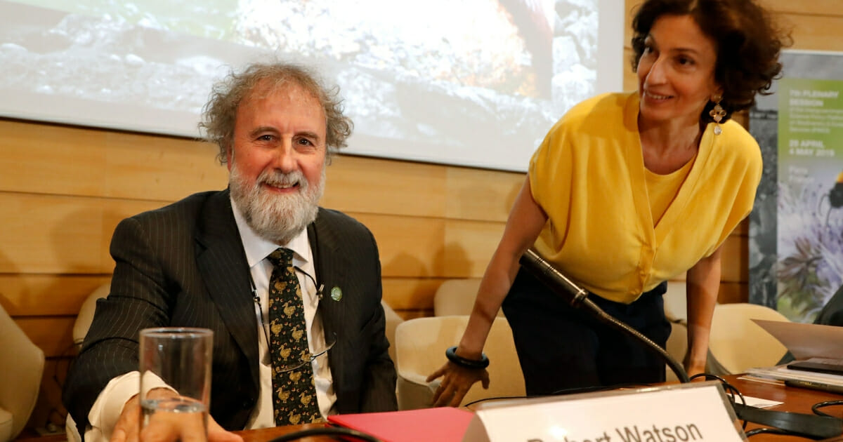 UNESCO's French general director Audrey Azoulay, right, next to Robert Watson, left, former chair of IPBES, attend the presentation of the report of the Intergovernmental Science-Policy Platform on Biodiversity and Ecosystem Services (IPBES) in Paris on May 6, 2019. (FRANCOIS GUILLOT / AFP / Getty Images)