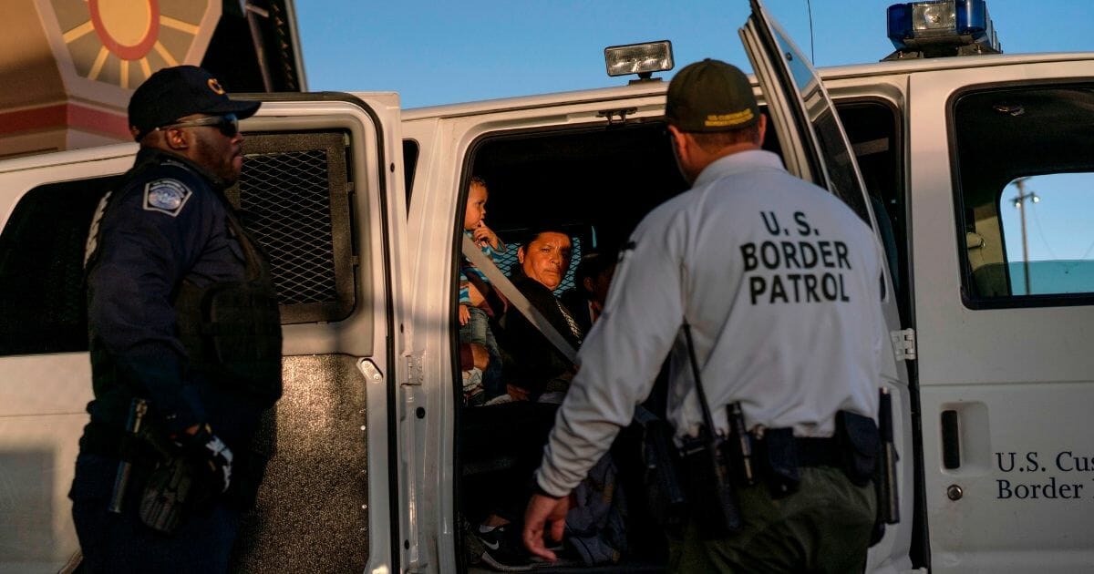 Illegal aliens in Border Patrol van.