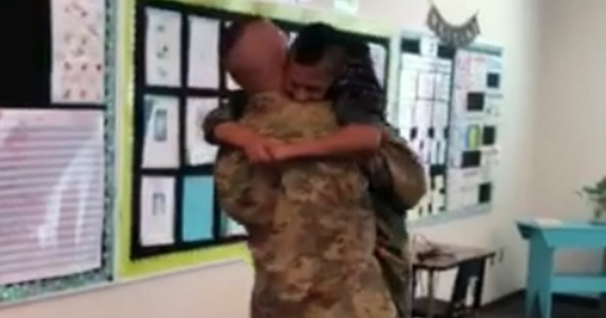 Two brothers hugging after one returned home from deployment.