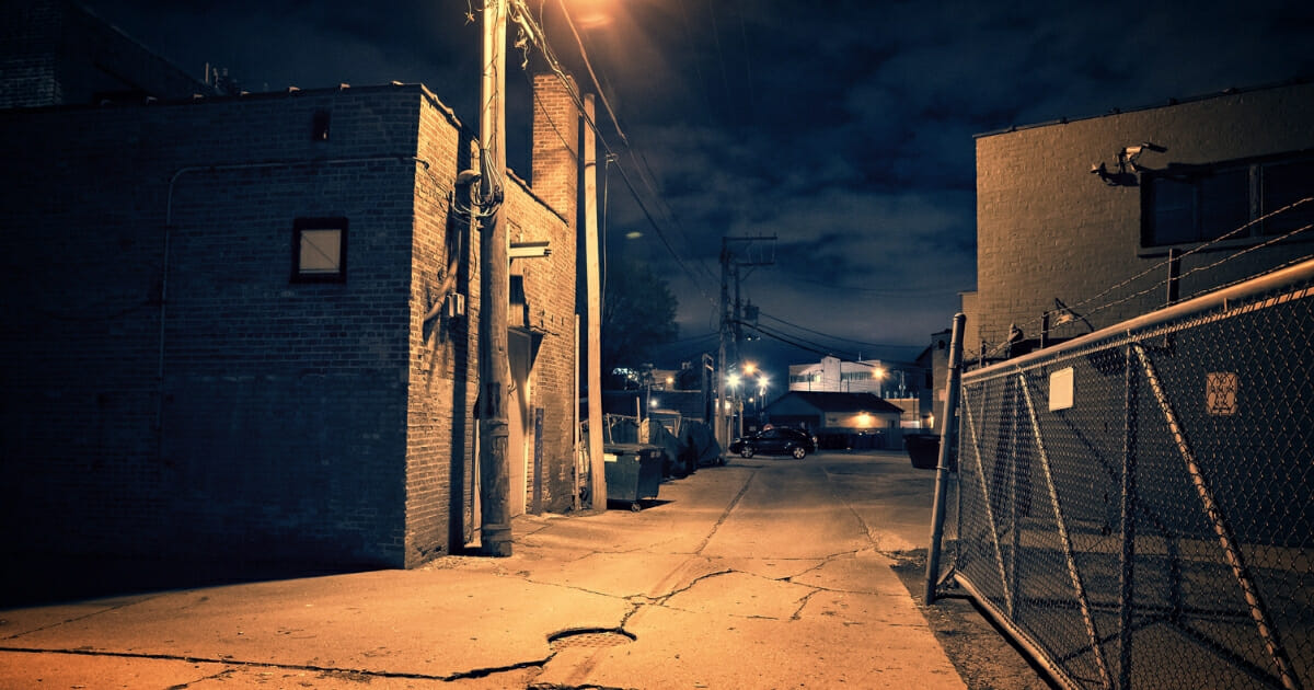 Urban alley at night.