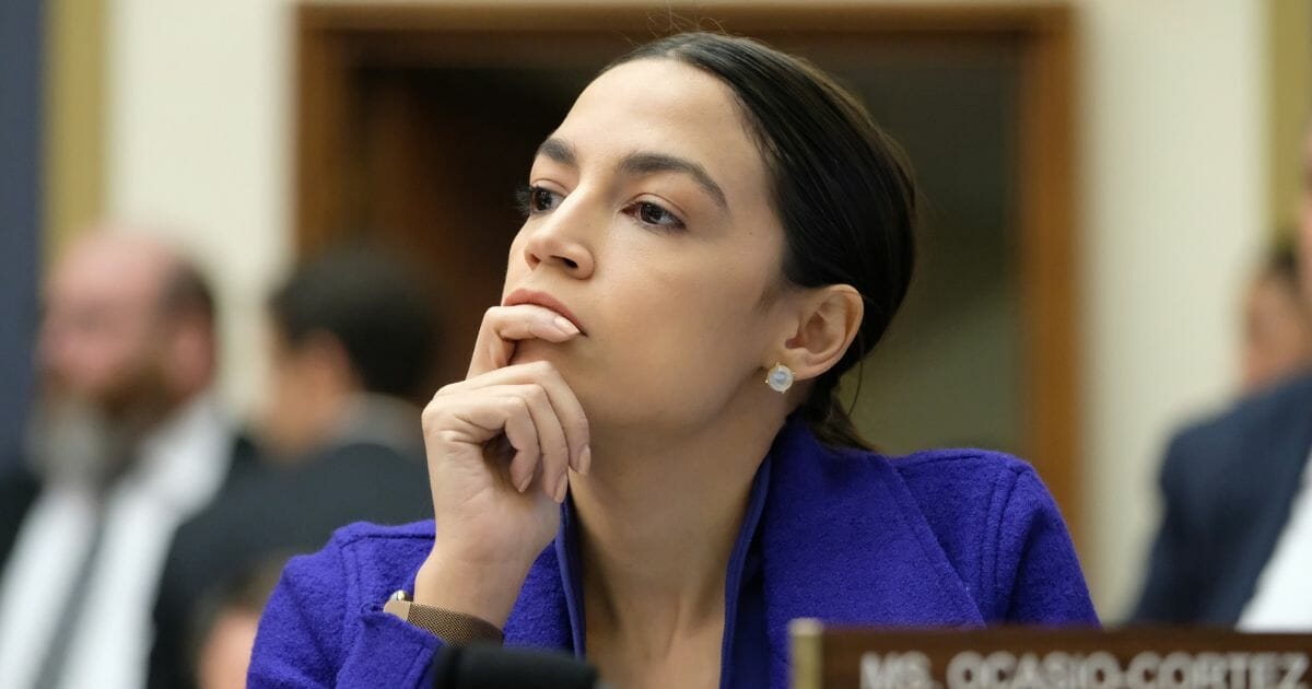 Rep. Alexandria Ocasio-Cortez listens during a House Financial Services Committee hearing on April 10, 2019, in Washington, D.C.