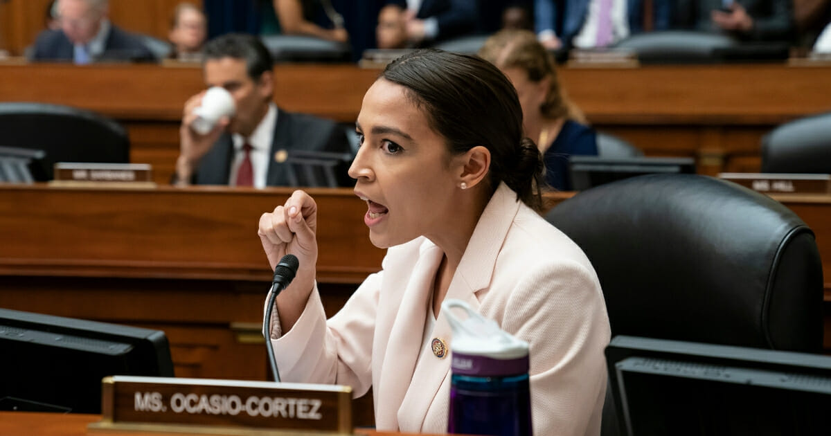 Rep. Alexandria Ocasio-Cortez, D-N.Y., makes an objection to a Republican argument as the House Oversight and Reform Committee considers whether to hold Attorney General William Barr and Commerce Secretary Wilbur Ross in contempt for failing to turn over subpoenaed documents related to the Trump administration's decision to add a citizenship question to the 2020 census, on Capitol Hill in Washington, Wednesday, June 12, 2019.