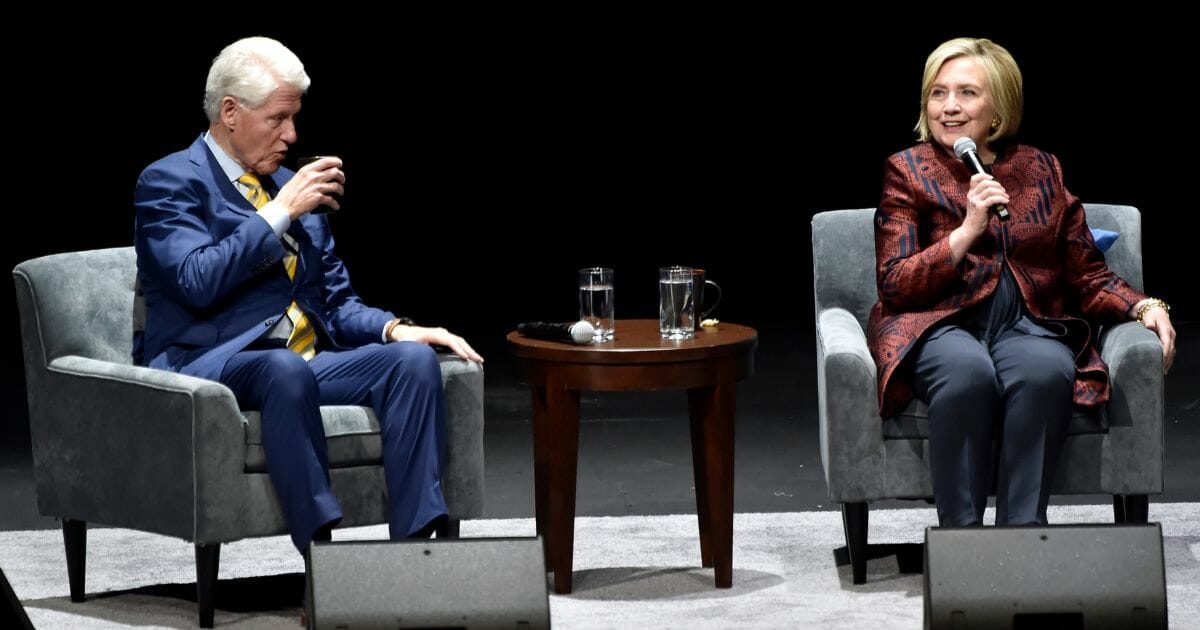 Bill and Hillary Clinton talk onstage at Park MGM on May 5, 2019, in Las Vegas, Nev.