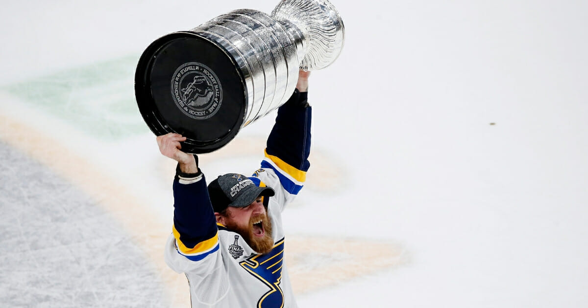 Ryan O'Reilly of the St. Louis Blues hoists the Stanley Cup.