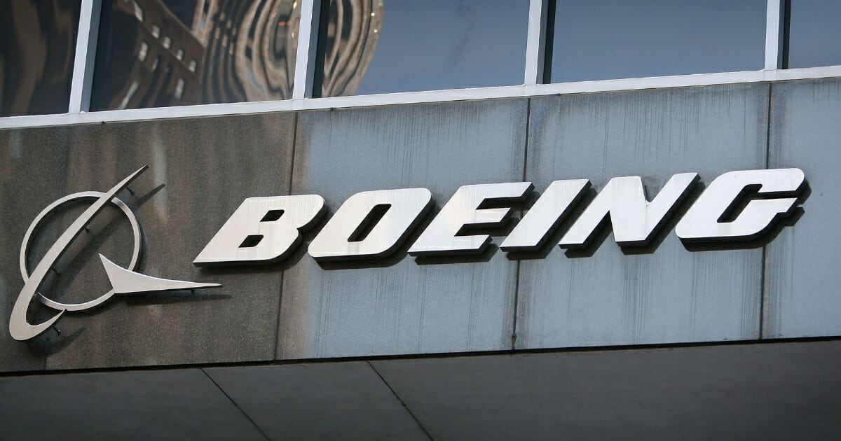 A sign hangs above the entrance to The Boeing Company's headquarters on January 28, 2009 in Chicago, Illinois.