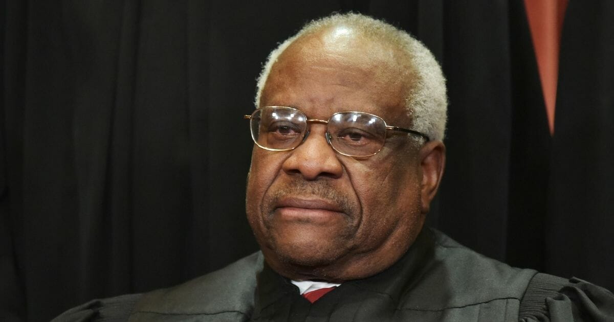 Associate Justice Clarence Thomas poses for the official group photo at the US Supreme Court in Washington, D.C. on Nov. 30, 2018.