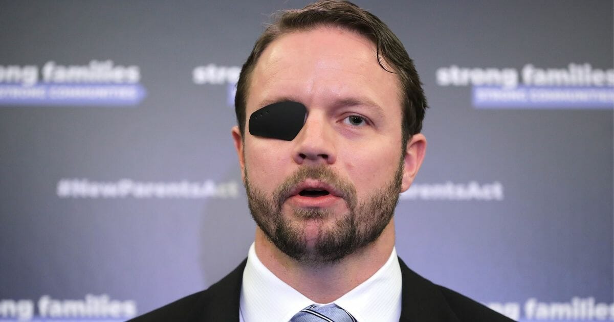 Texas Rep. Dan Crenshaw speaks at a news conference on March 27, 2019, in Washington, D.C.