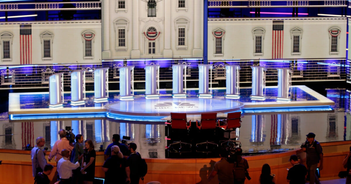 Members of the media gather for a walk-through of the stage set-up for the first Democratic presidential debate.